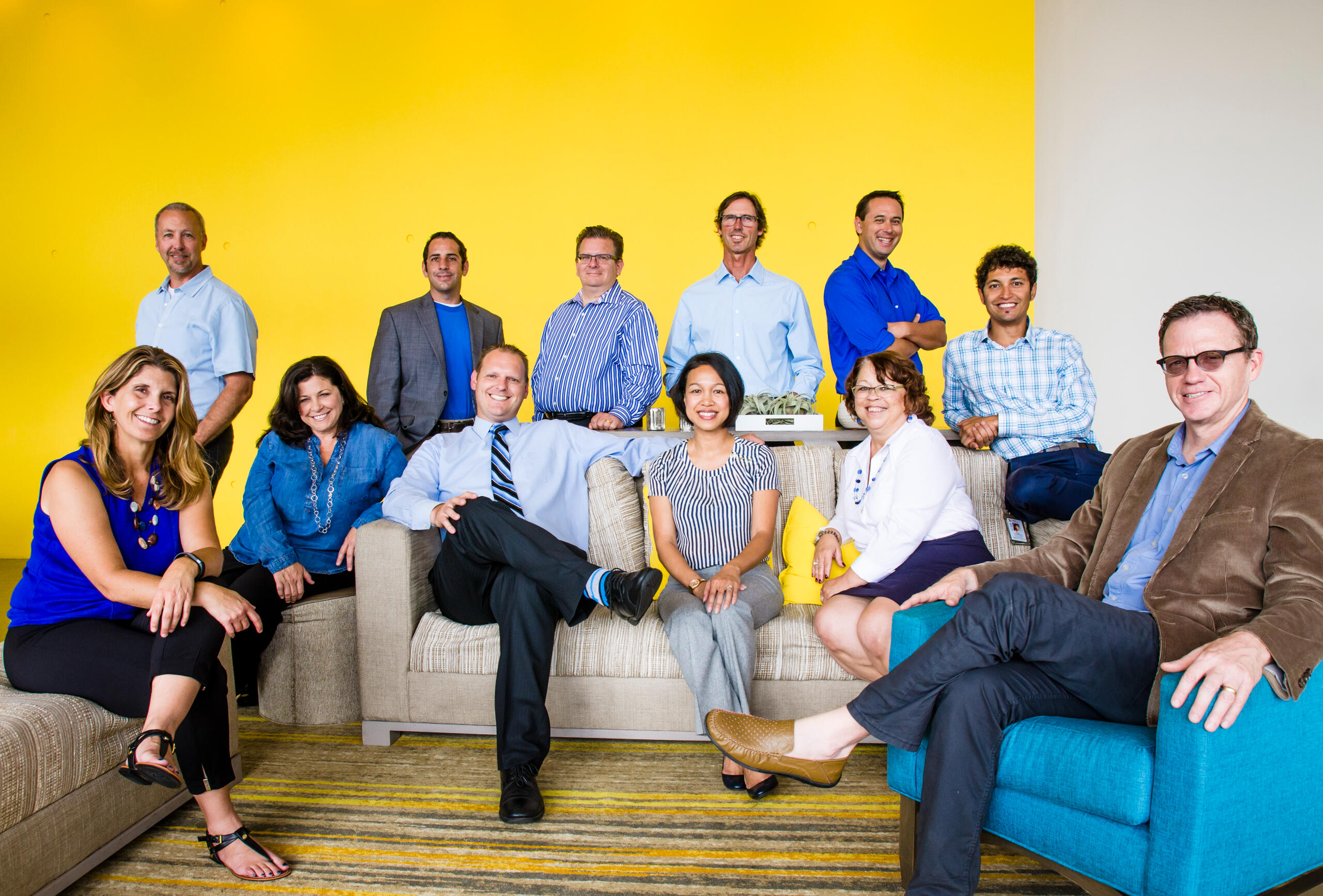 City department staff portrait posed in a vibrant office environment, photographed with color-forward lighting to emphasize approachability and leadership.